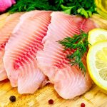18895942-Tilapia-fillets-with-dill-parsley-lemon-a-bottle-of-vegetable-oil-ginger-pink-cloth-bell-pepper-on-a-Stock-Photo